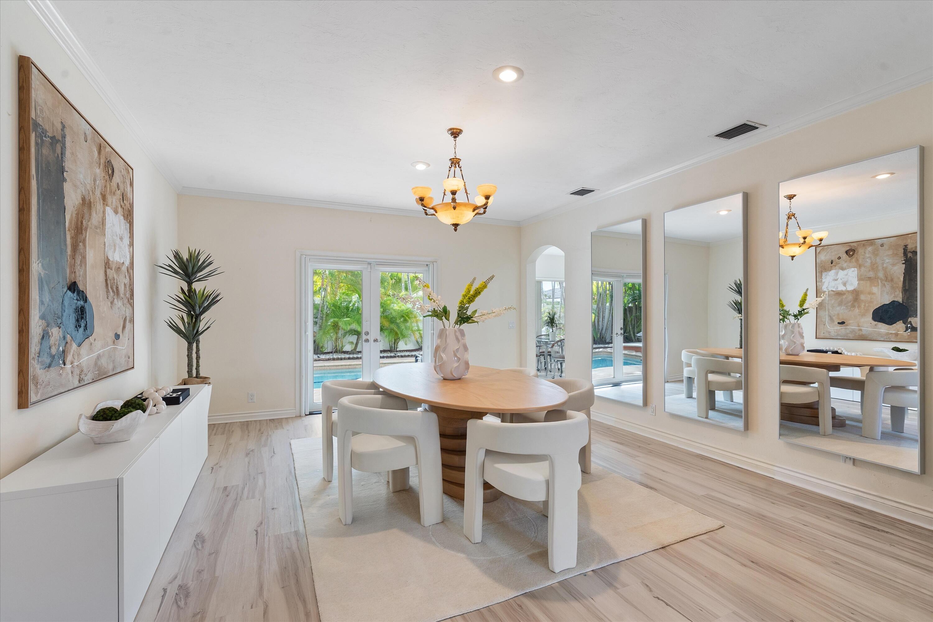 710 Marble Way Boca Raton, FL 33432 - Photo 5 of 57 a view of a dining room with furniture window and wooden floor