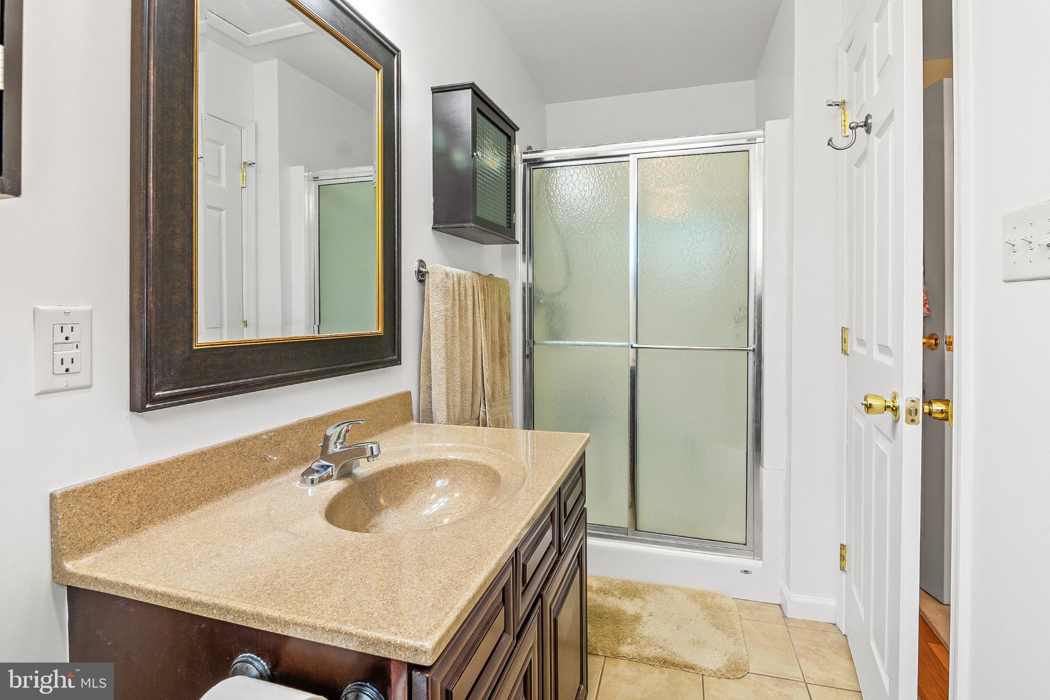 5412 Ridge Road Mount Airy, MD 21771 - Photo 16 of 38 Modern bathroom with sleek finishes.