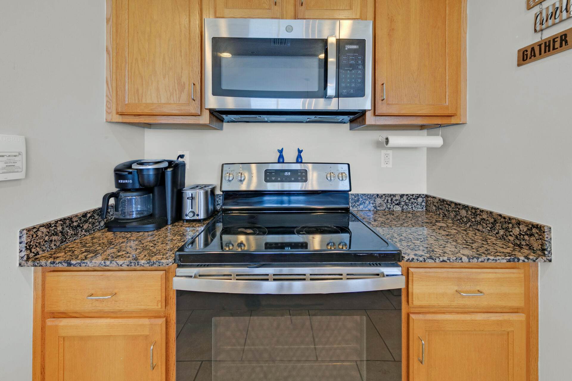 12011 Front Beach Road, Unit 701 Panama City Beach, FL 32407 - Photo 12 of 42 a stove top oven sitting inside of a kitchen