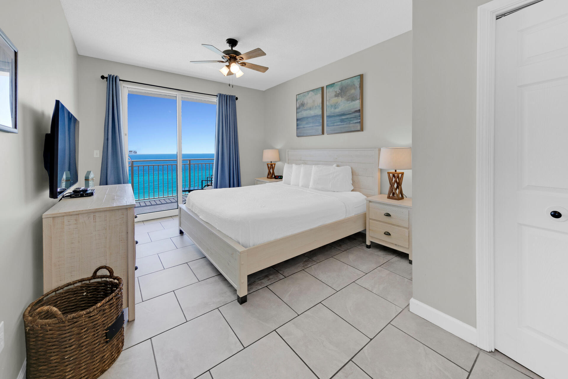 12011 Front Beach Road, Unit 701 Panama City Beach, FL 32407 - Photo 13 of 42 a bedroom with a bed and a flat screen tv