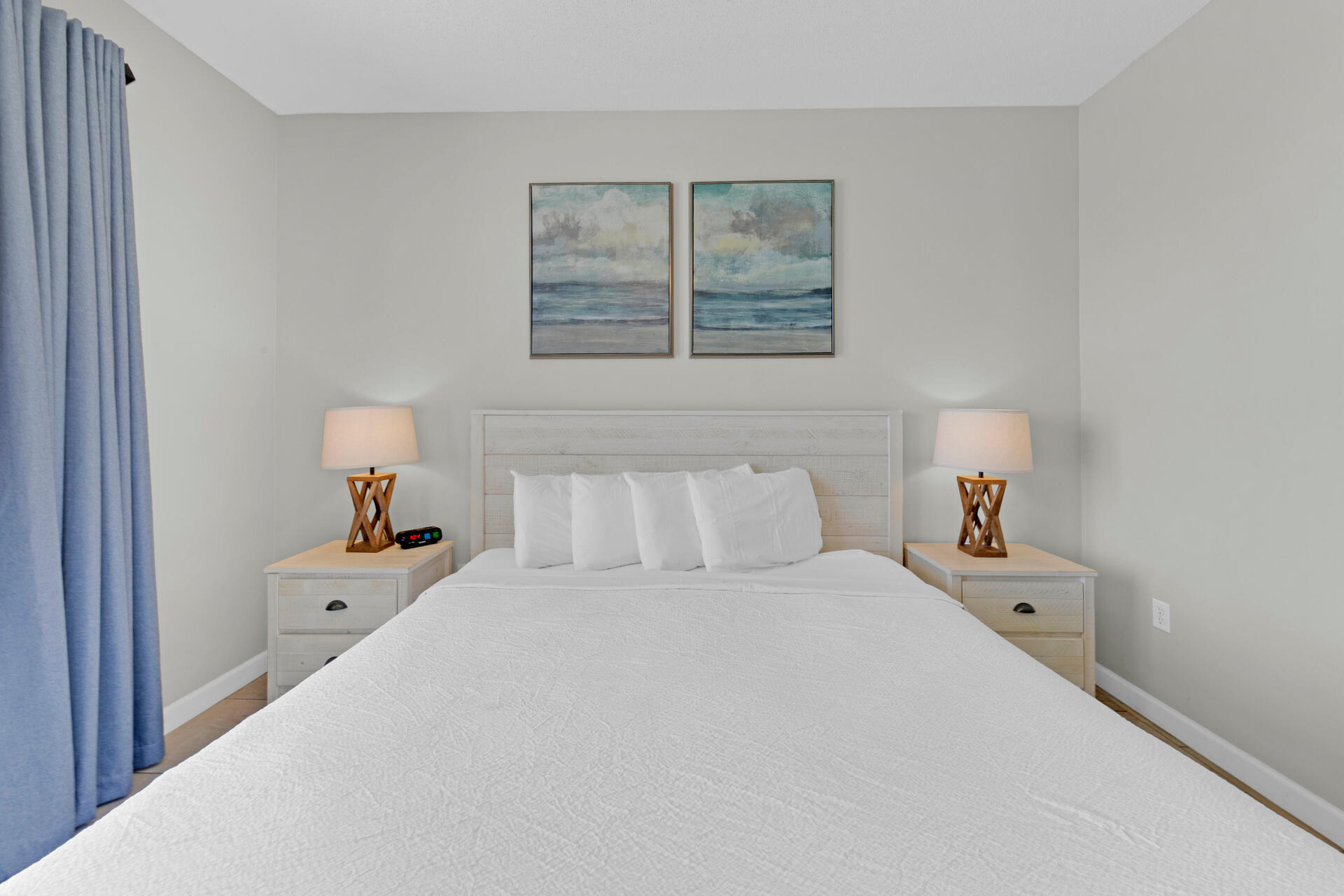 12011 Front Beach Road, Unit 701 Panama City Beach, FL 32407 - Photo 16 of 42 a bedroom with a bed and a window