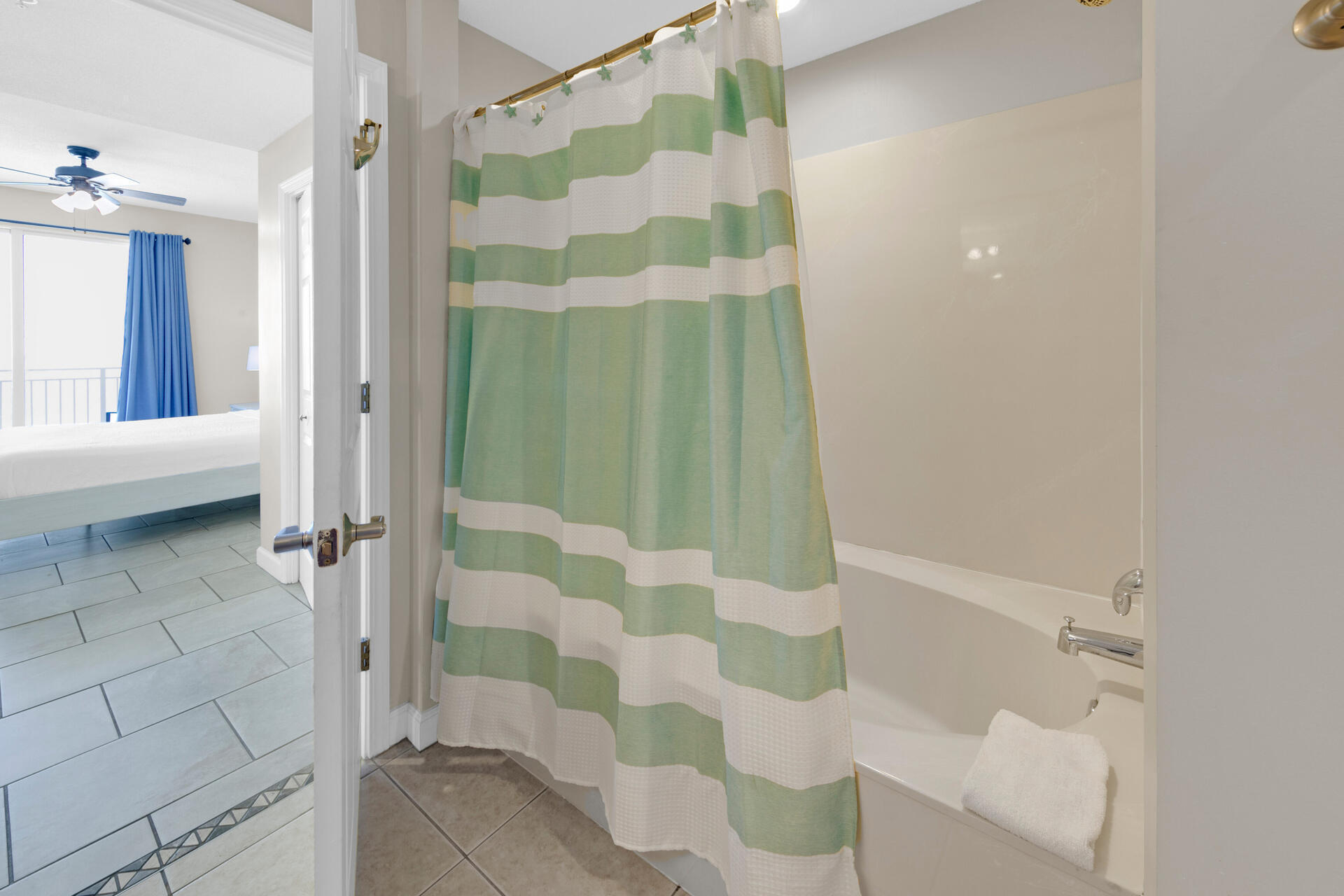 12011 Front Beach Road, Unit 701 Panama City Beach, FL 32407 - Photo 17 of 42 a bathroom with a shower and a sink