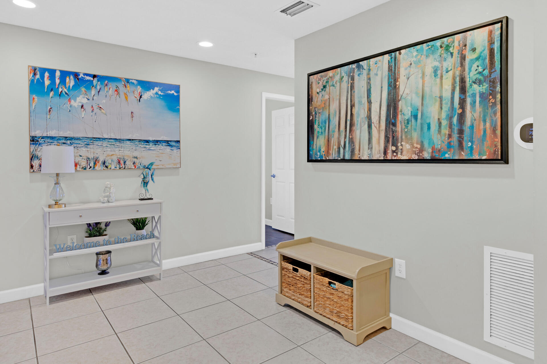 12011 Front Beach Road, Unit 701 Panama City Beach, FL 32407 - Photo 21 of 42 a room with painting on the wall and a window