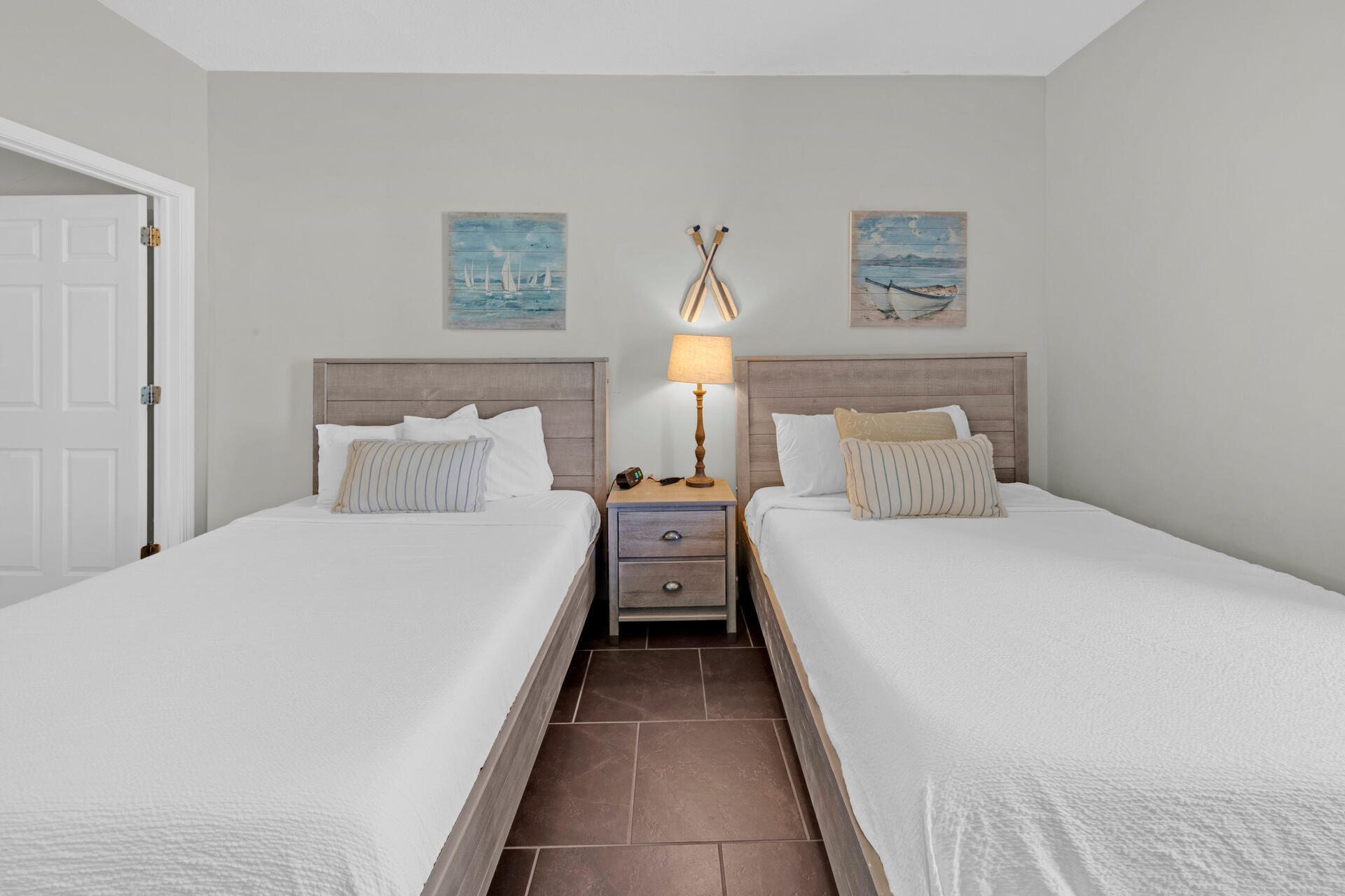 12011 Front Beach Road, Unit 701 Panama City Beach, FL 32407 - Photo 23 of 42 a bedroom with bed and painting on the wall
