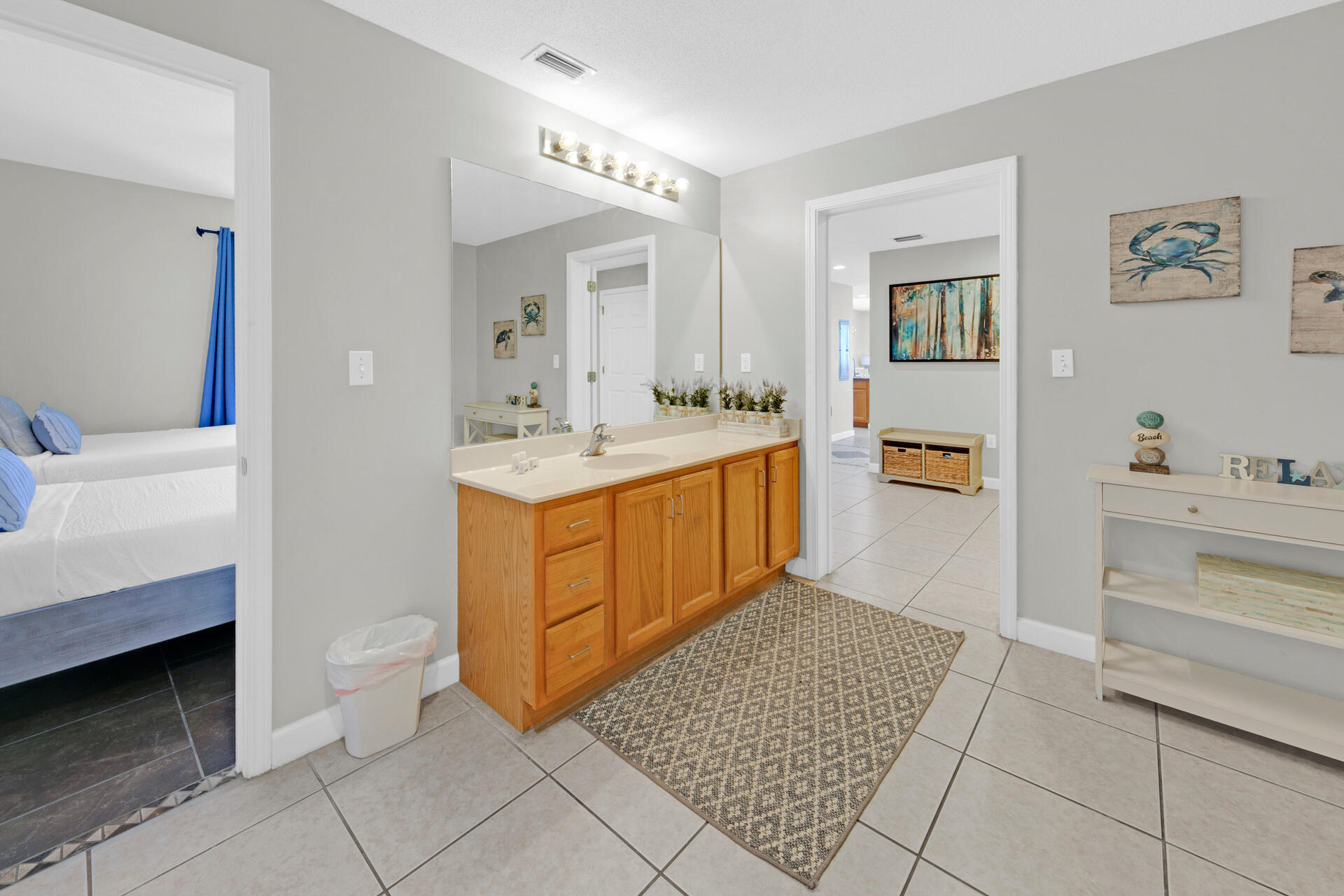 12011 Front Beach Road, Unit 701 Panama City Beach, FL 32407 - Photo 28 of 42 a spacious bathroom with a sink a mirror and a bathtub