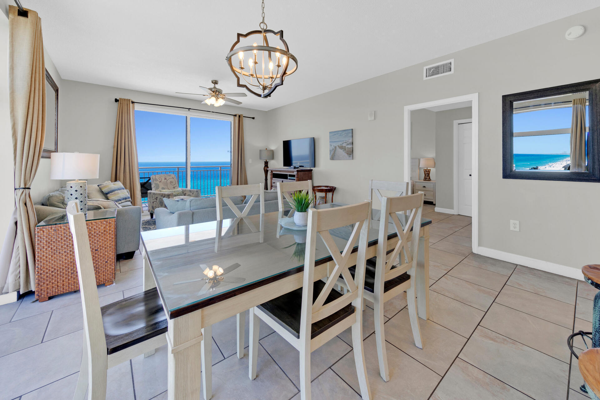 12011 Front Beach Road, Unit 701 Panama City Beach, FL 32407 - Photo 7 of 42 a view of a dining room with furniture