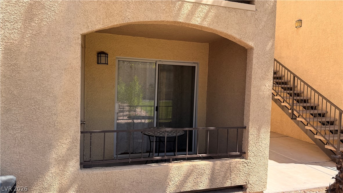 7885 West Flamingo Road, Unit 1131 Las Vegas, NV 89147 - Photo 9 of 36 A private patio space with a sliding glass door offers an intimate outdoor retreat.