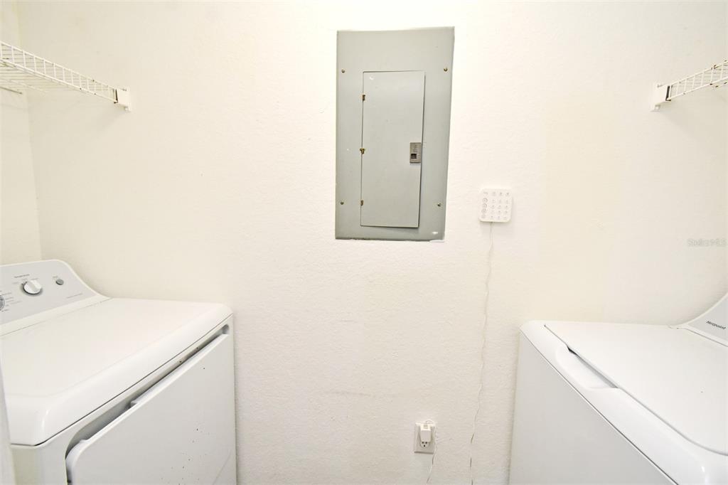 5467 Vineland Road, Unit 6308 Orlando, FL 32811 - Photo 27 of 36 a utility room with dryer and washer