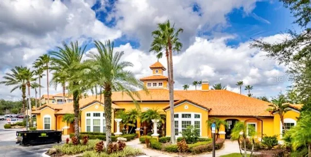 a view of multiple houses with a street