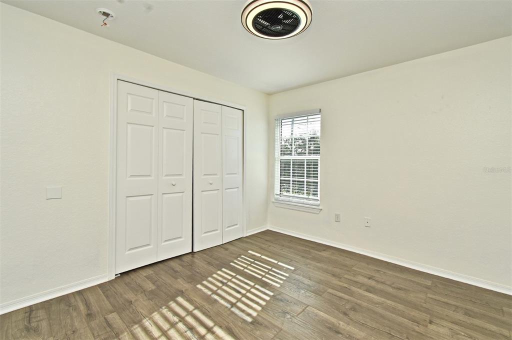 5467 Vineland Road, Unit 6308 Orlando, FL 32811 - Photo 4 of 36 an empty room with windows