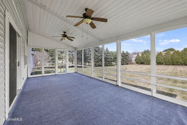 a view of an empty room with windows