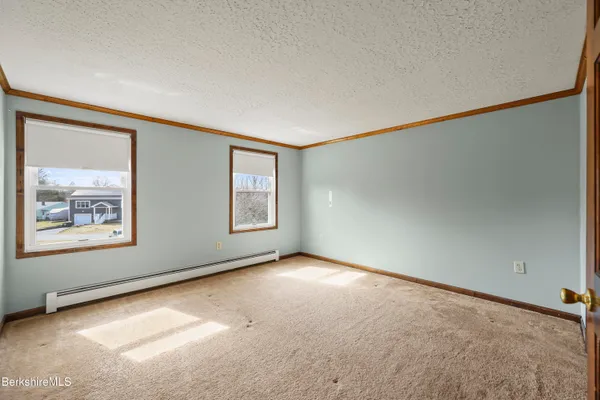 an empty room with closet area