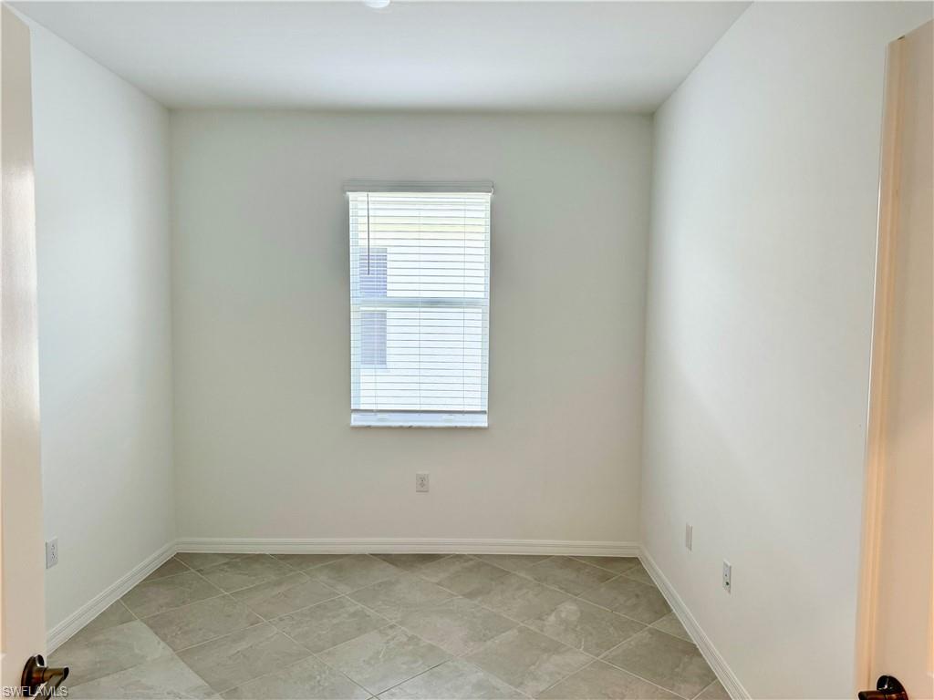 2258 Avocado Lane Naples, FL 34120 - Photo 13 of 18 an empty room with a window