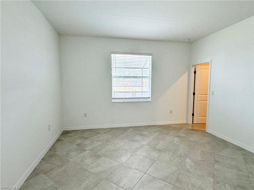 2258 Avocado Lane Naples, FL 34120 - Photo 5 of 18 an empty room with a window