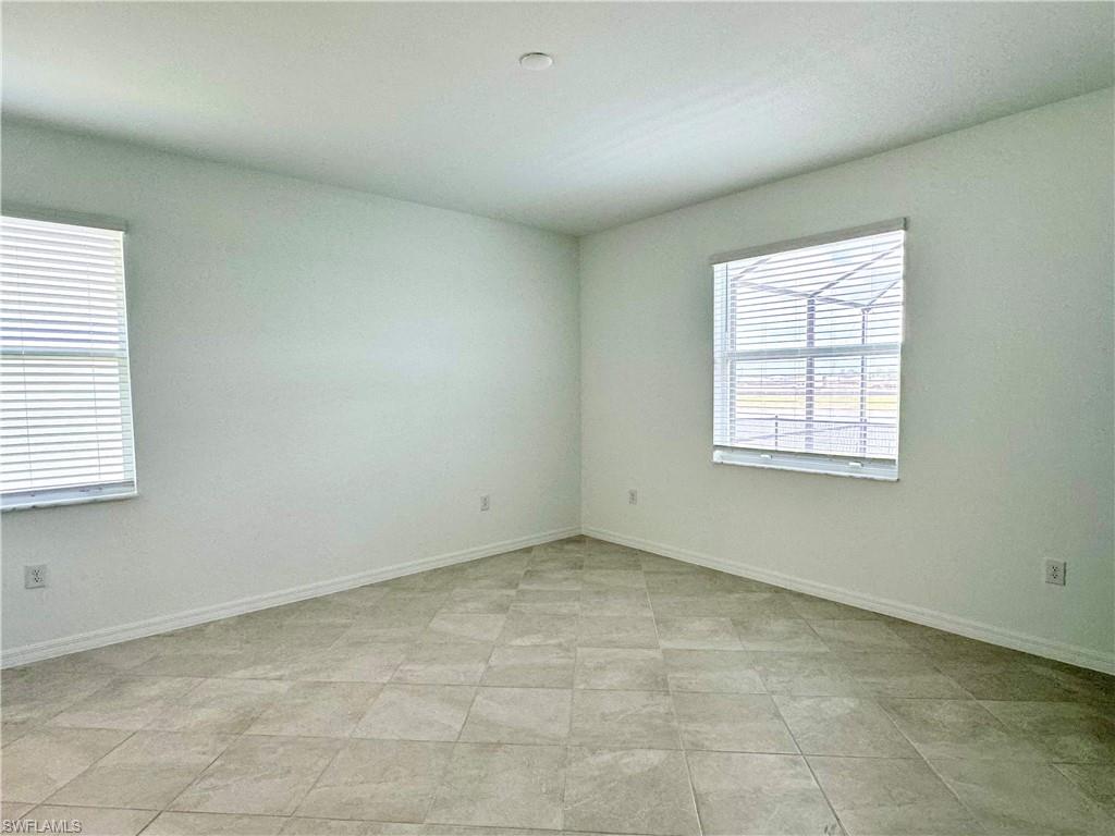 2258 Avocado Lane Naples, FL 34120 - Photo 6 of 18 an empty room with windows