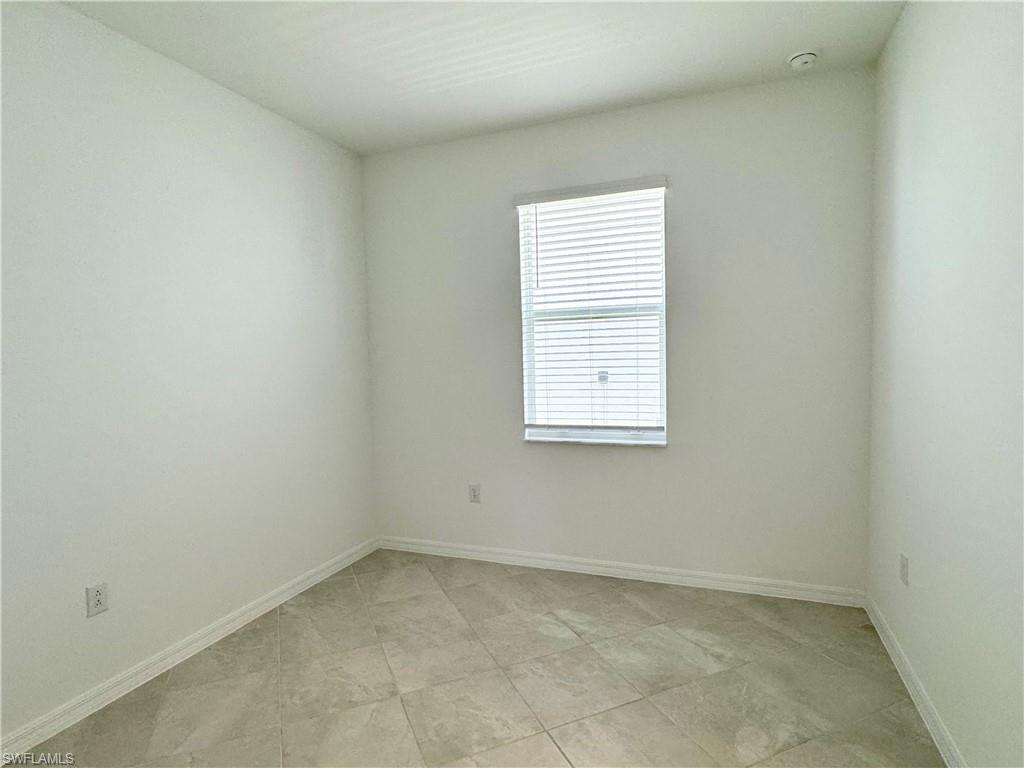 2258 Avocado Lane Naples, FL 34120 - Photo 9 of 18 an empty room with a window