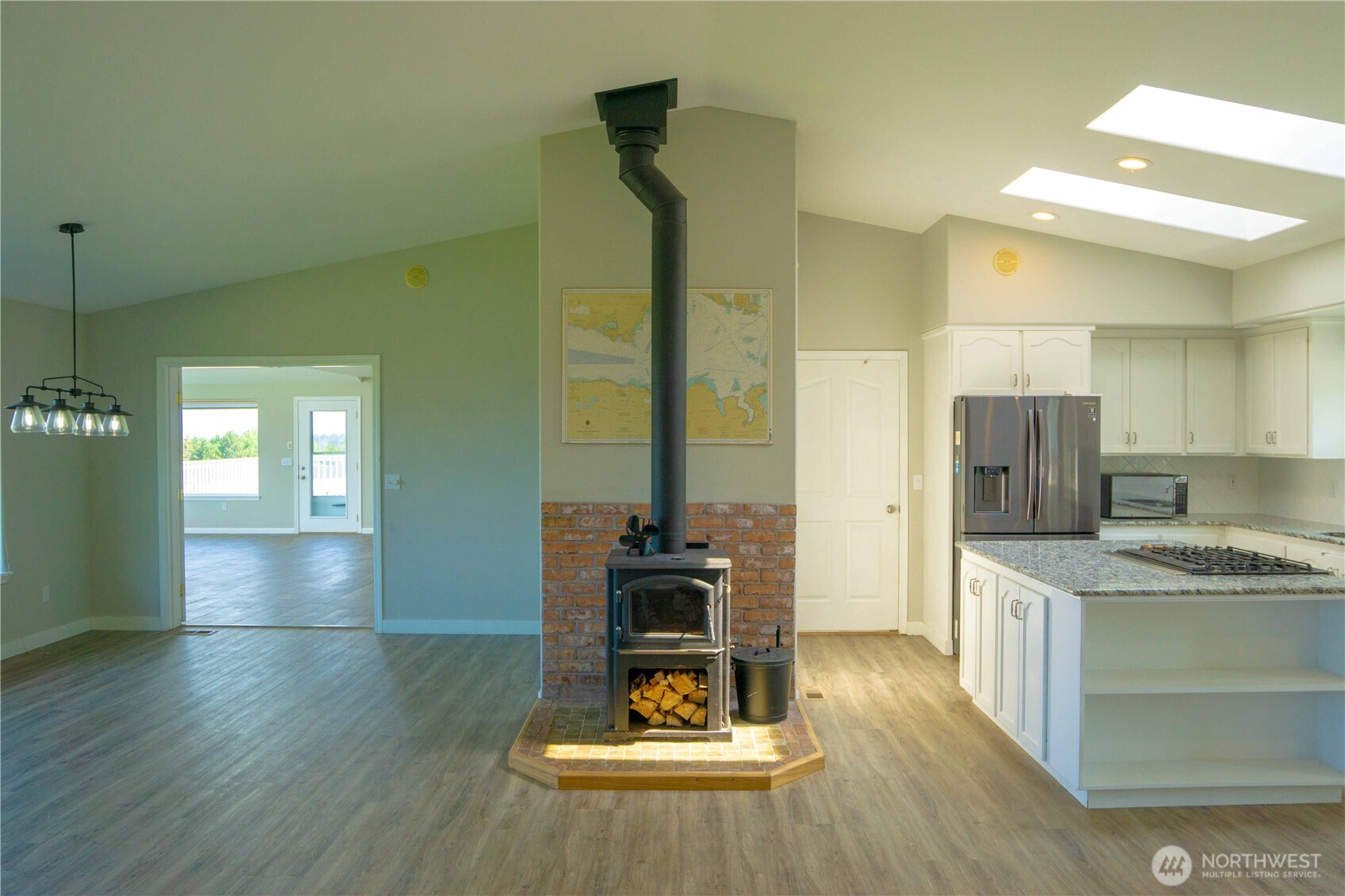 71 Le Roux Road Sequim, WA 98382 - Photo 11 of 40 a kitchen with a sink and refrigerator