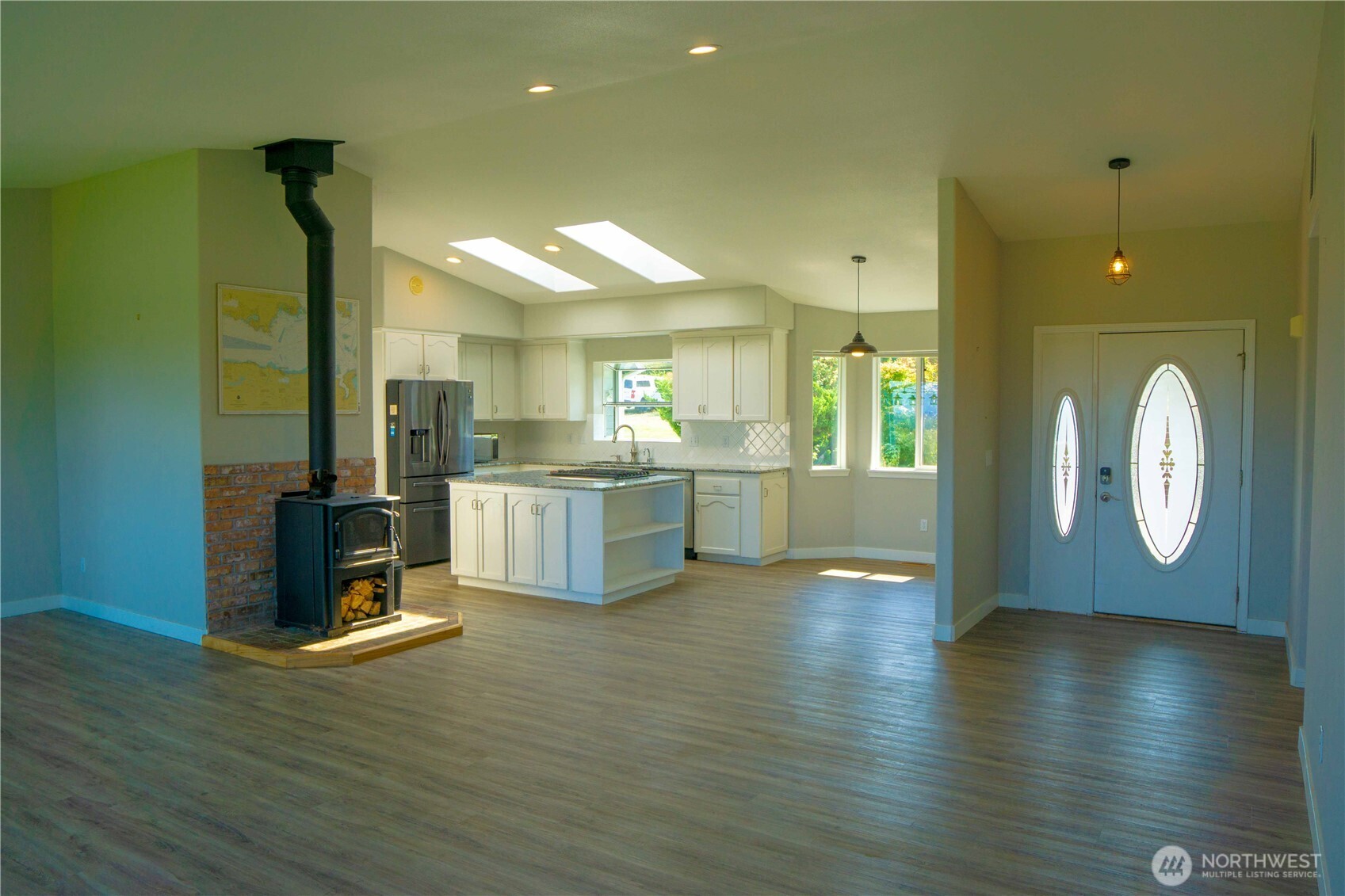 71 Le Roux Road Sequim, WA 98382 - Photo 12 of 40 a view of kitchen with cabinets and wooden floor