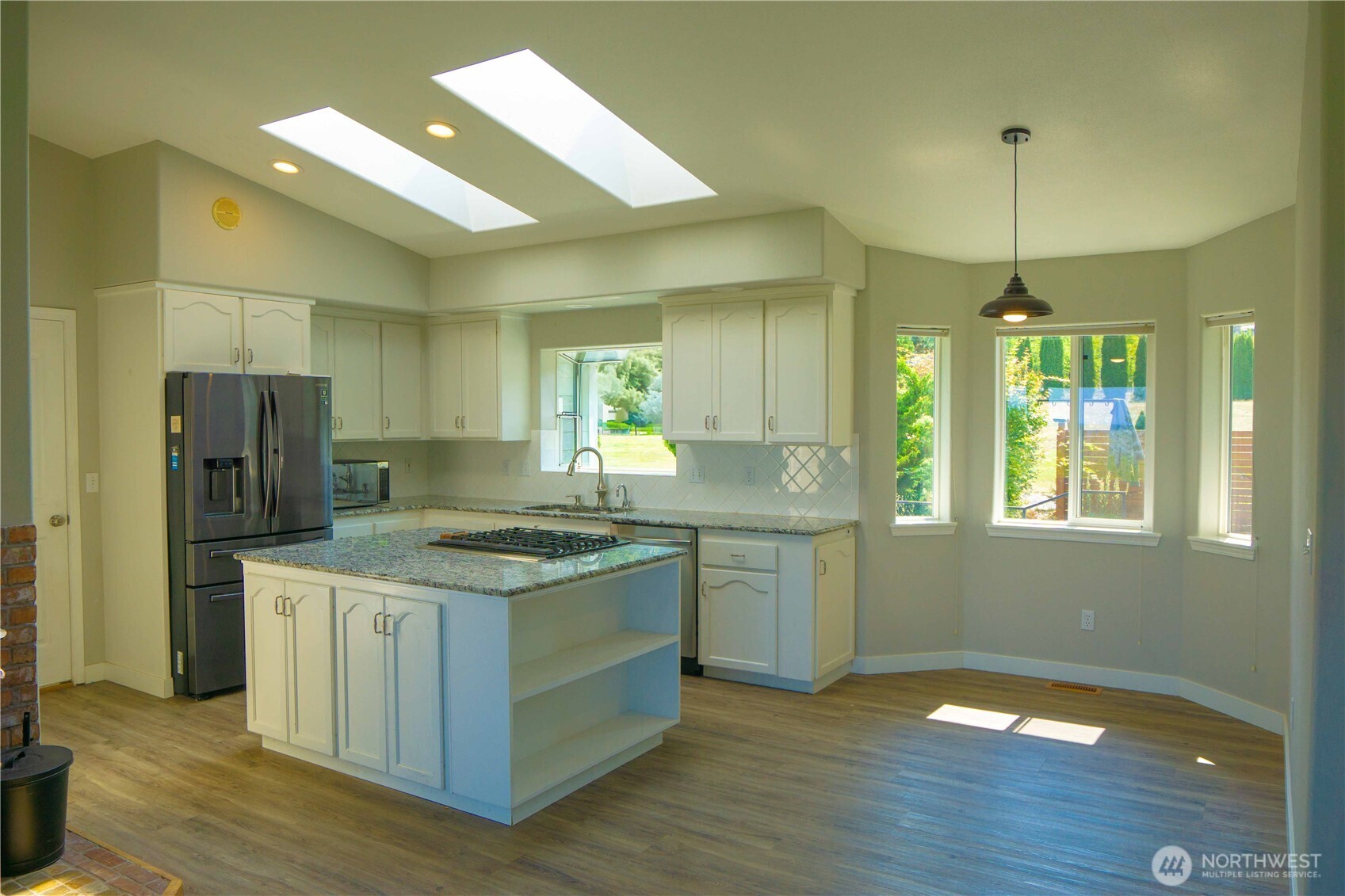71 Le Roux Road Sequim, WA 98382 - Photo 13 of 40 a kitchen that has a lot of cabinets a sink and appliances in it