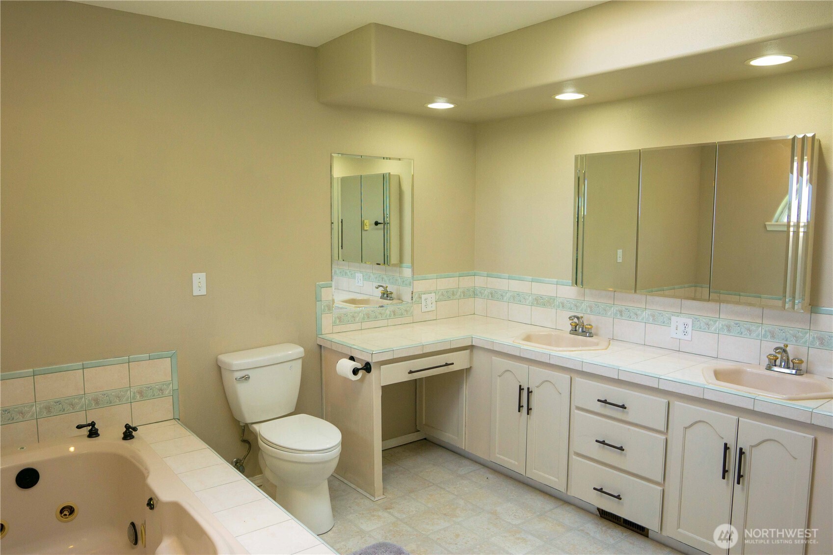 71 Le Roux Road Sequim, WA 98382 - Photo 20 of 40 a bathroom with a toilet a double vanity sink and mirror