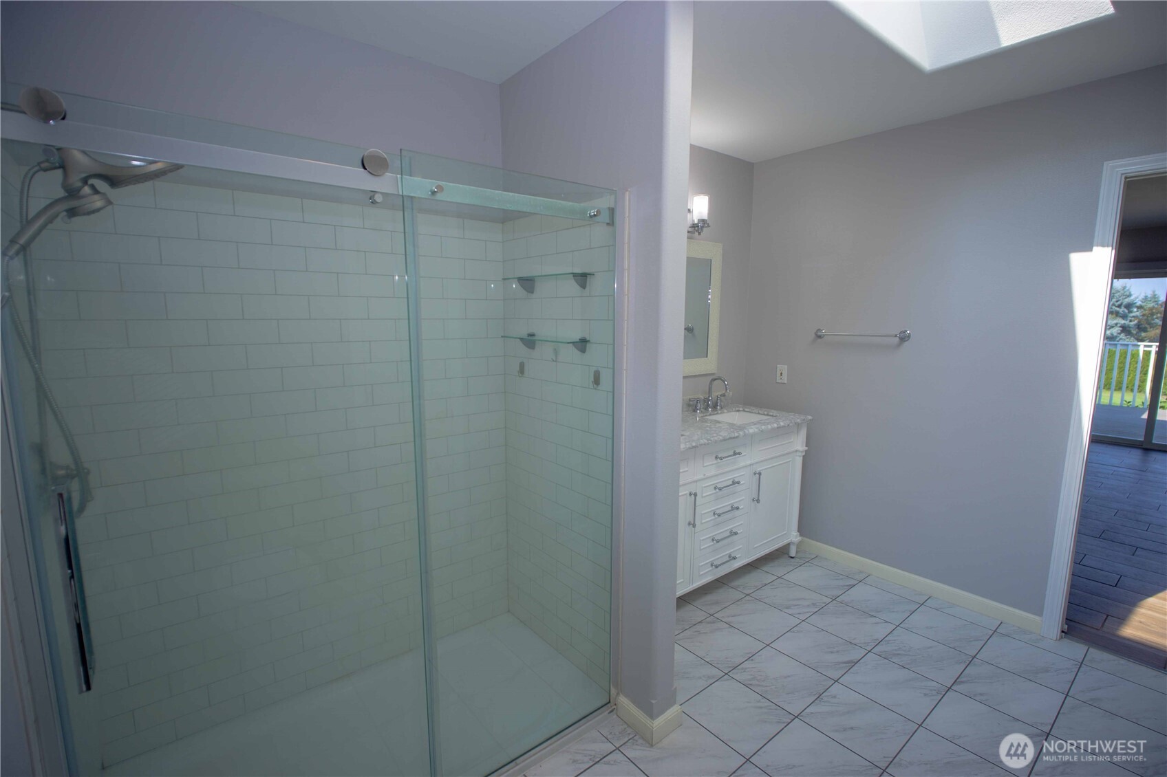 71 Le Roux Road Sequim, WA 98382 - Photo 25 of 40 a bathroom with a shower and a sink
