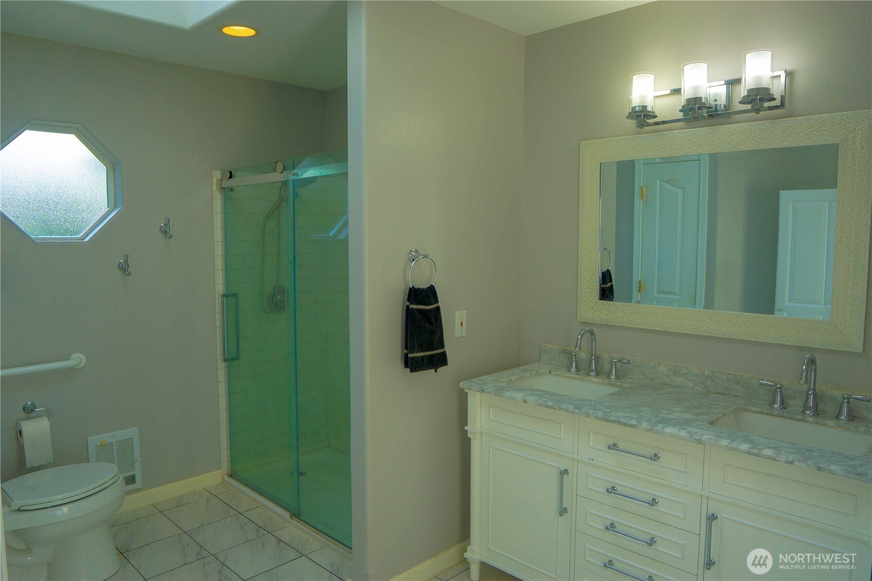 71 Le Roux Road Sequim, WA 98382 - Photo 26 of 40 a bathroom with a sink and mirror