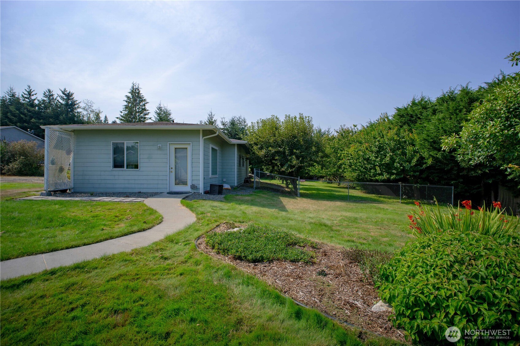 71 Le Roux Road Sequim, WA 98382 - Photo 29 of 40 a view of a backyard with a garden