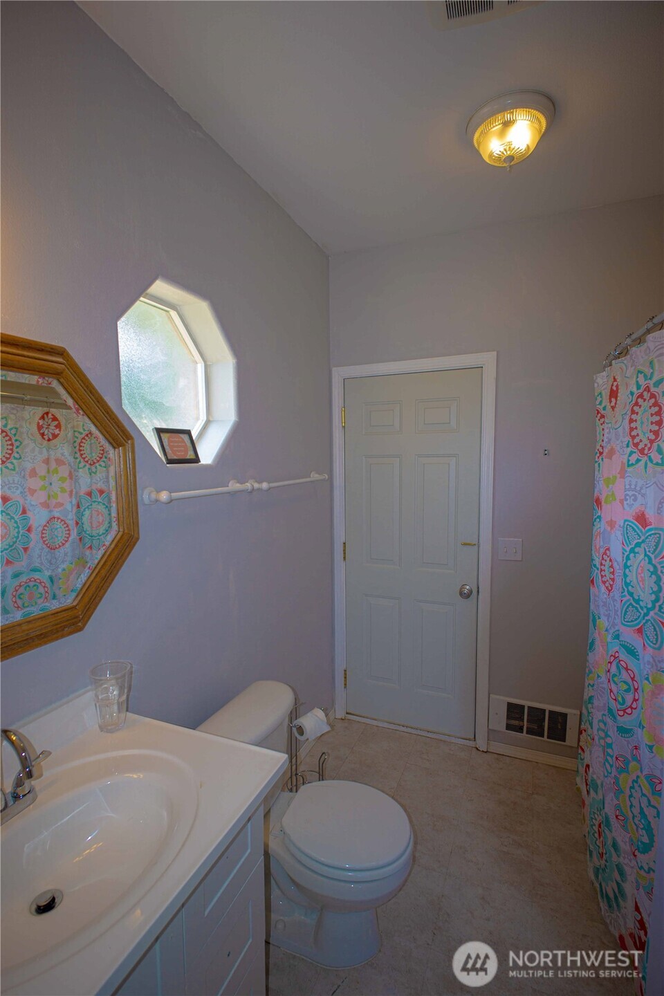 71 Le Roux Road Sequim, WA 98382 - Photo 34 of 40 a bathroom with a sink mirror and toilet