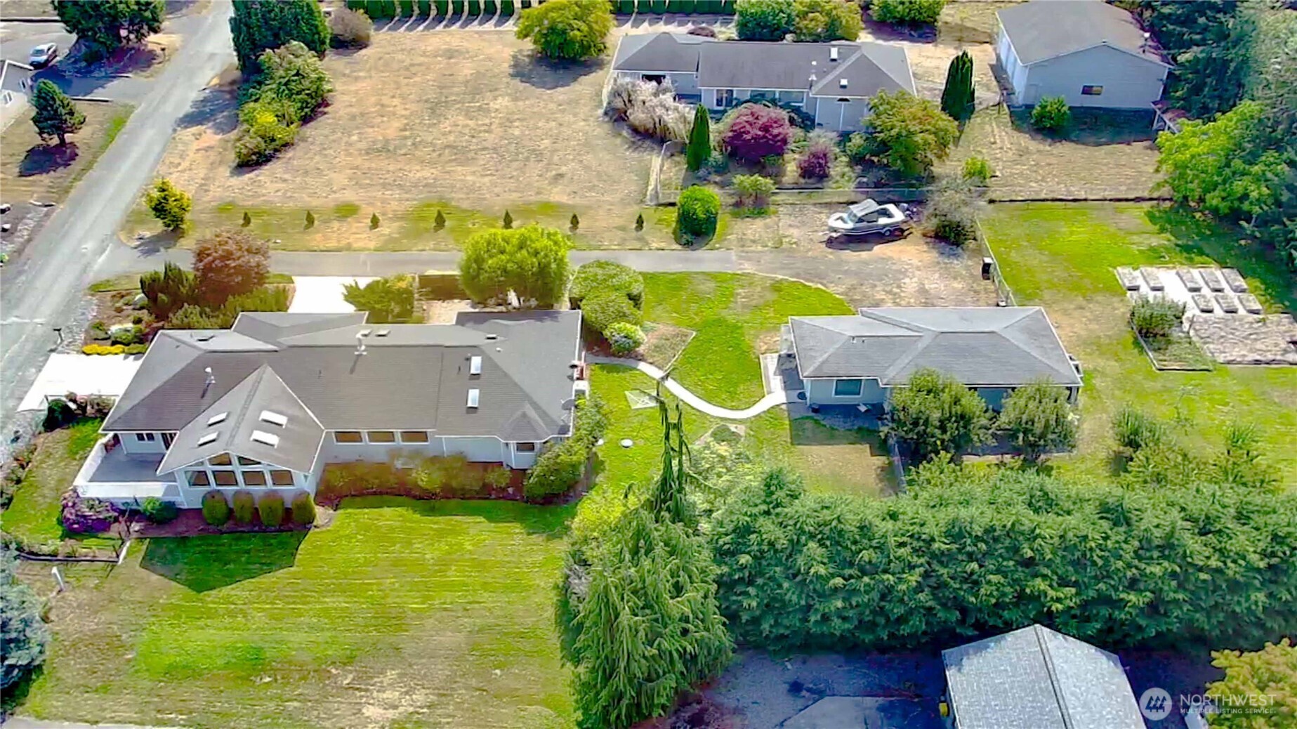 71 Le Roux Road Sequim, WA 98382 - Photo 40 of 40 an aerial view of a house with swimming pool and garden