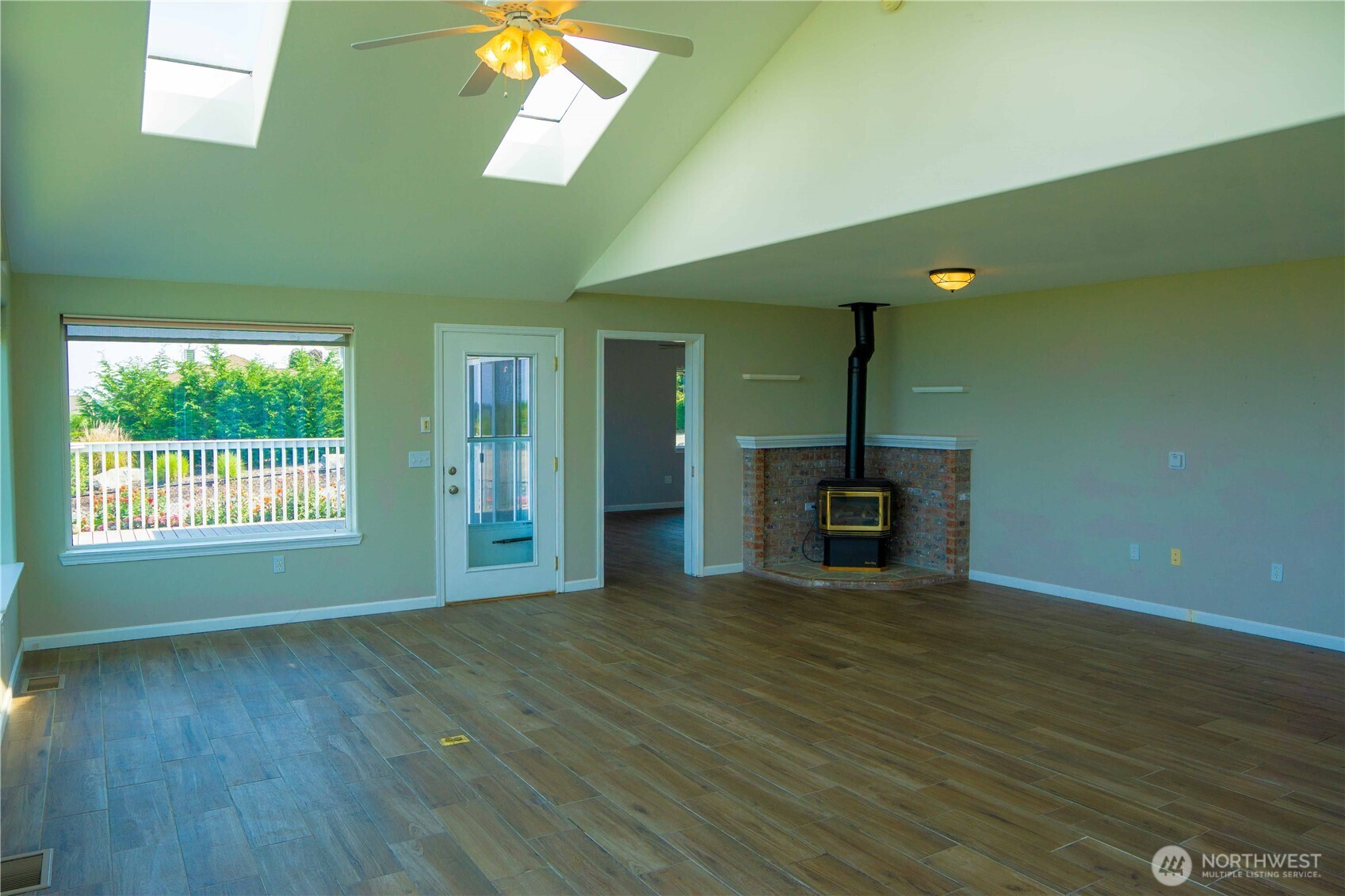 71 Le Roux Road Sequim, WA 98382 - Photo 6 of 40 a view of a livingroom with a kitchen and a fireplace