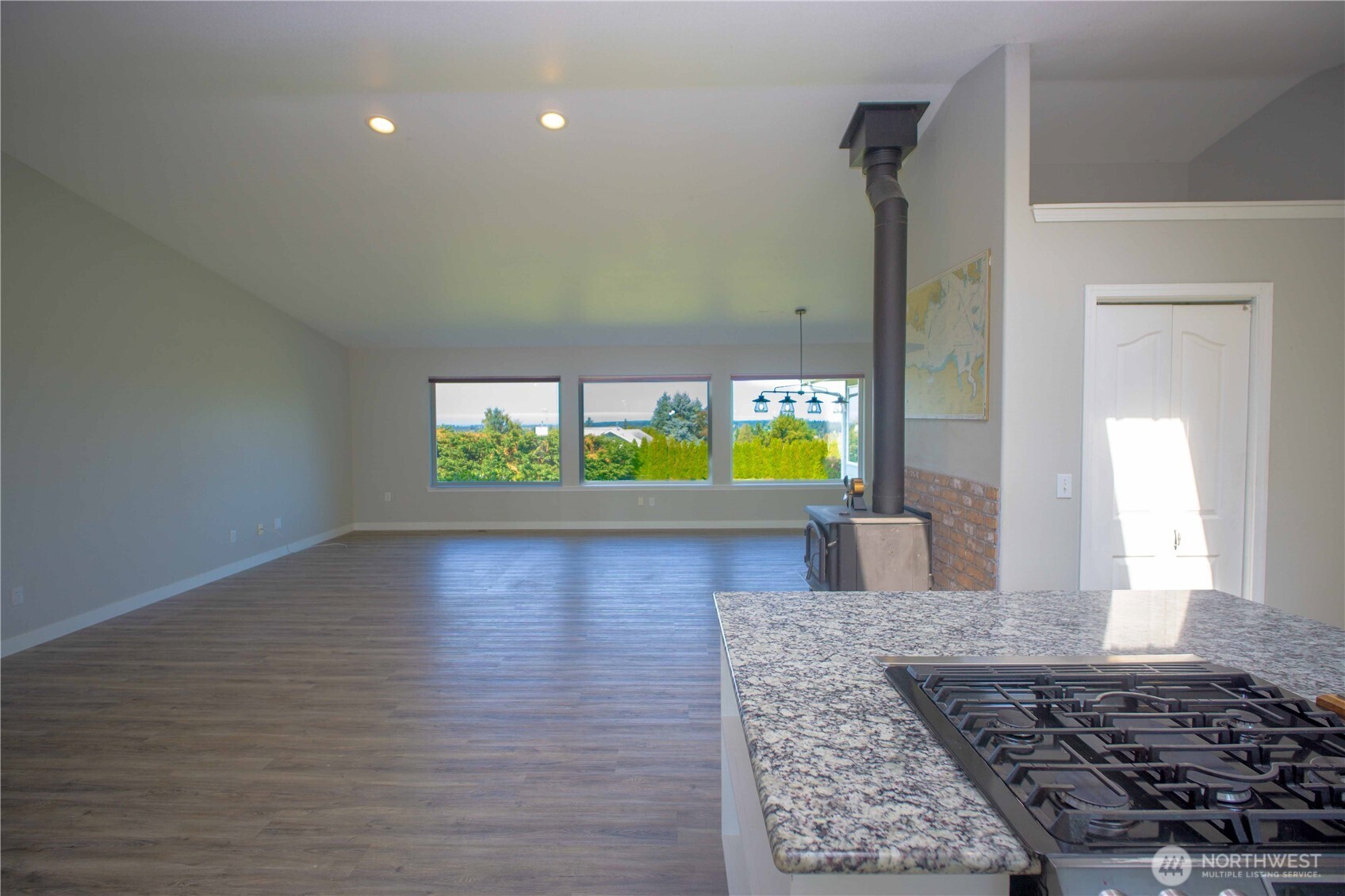 71 Le Roux Road Sequim, WA 98382 - Photo 7 of 40 a view of a living room and a floor to ceiling window