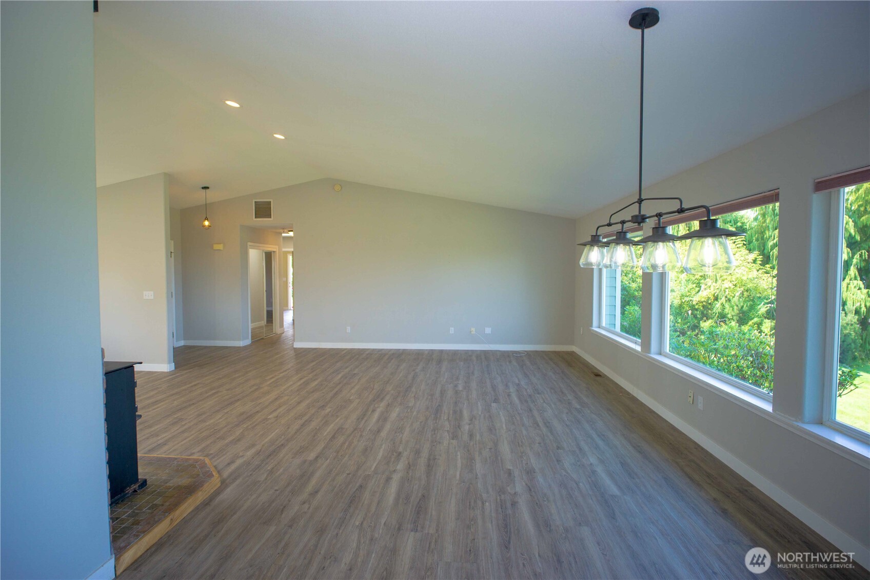 71 Le Roux Road Sequim, WA 98382 - Photo 9 of 40 a view of a room with wooden floor fan and window