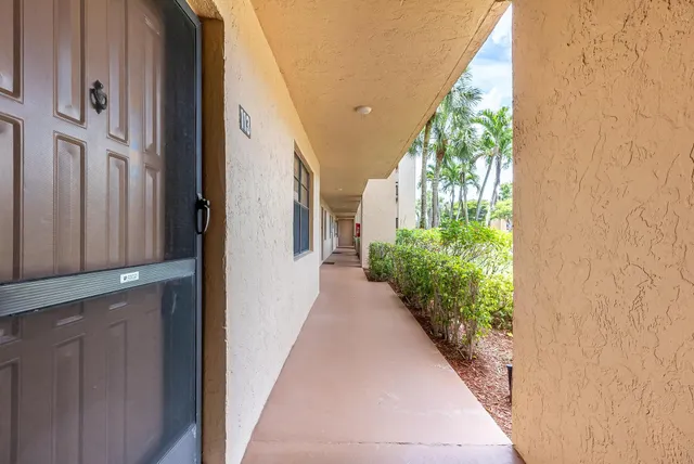 a view of a pathway both side of house