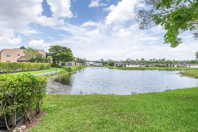 a view of a lake with a big yard