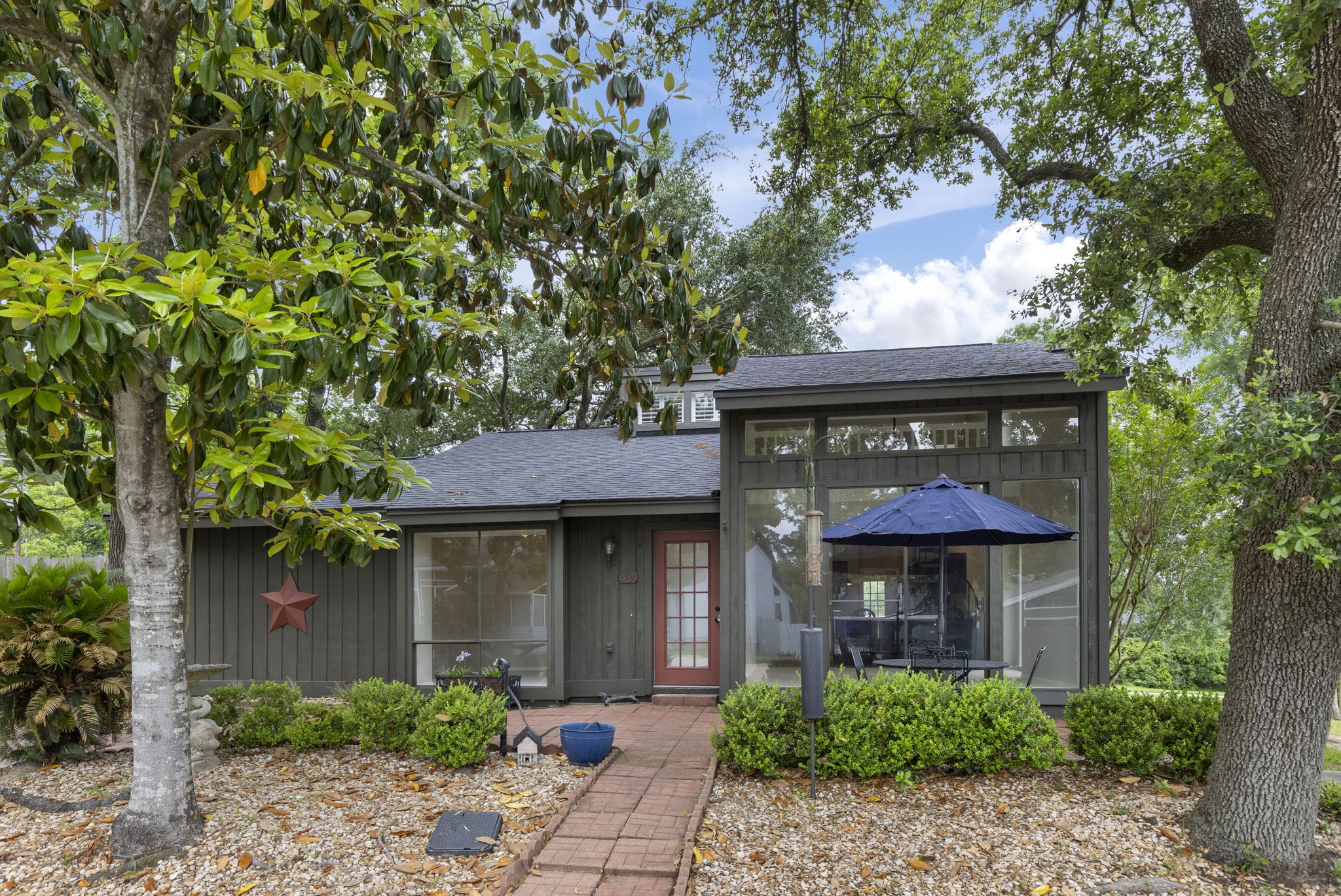 49 April Village Conroe, TX 77356 - Photo 44 of 46 a front view of a house with garden