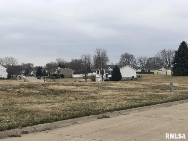 a view of a town with big trees