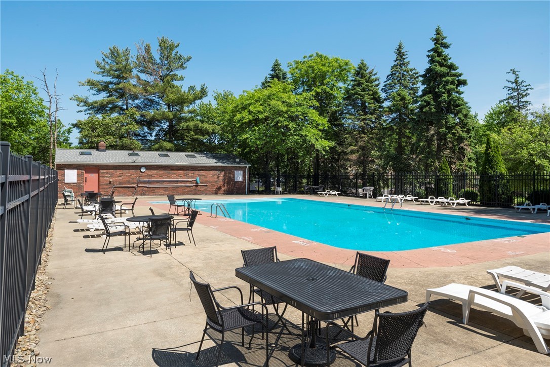 6484 State Road Parma, OH 44134 - Photo 36 of 36 Pool area with ample space for lounging, dining, and enjoying the outdoors.