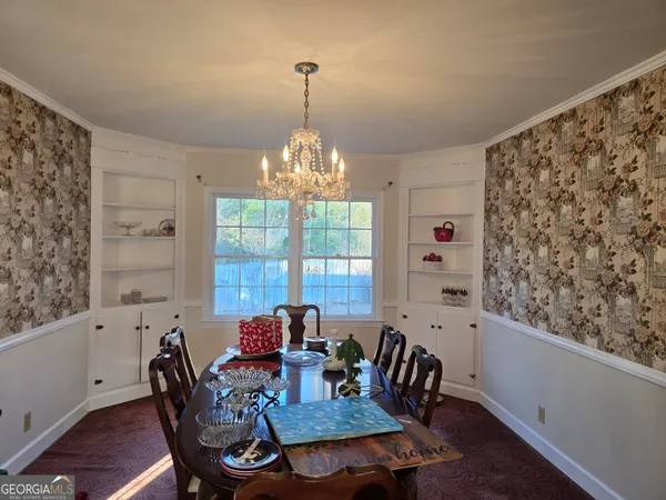 a view of a dining room with furniture window and outside view