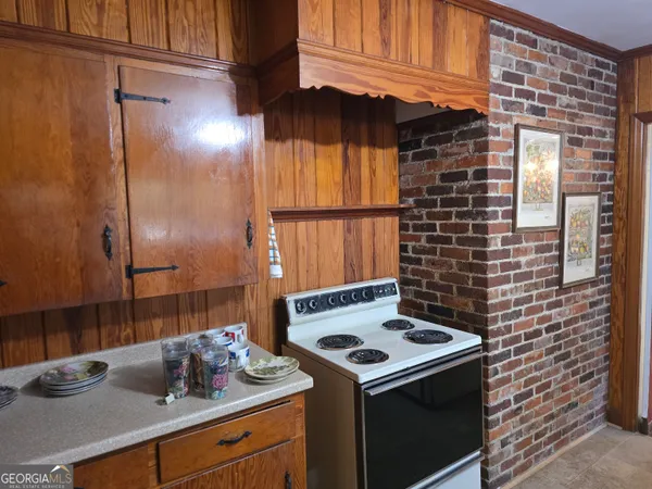 a kitchen with a stove and a sink