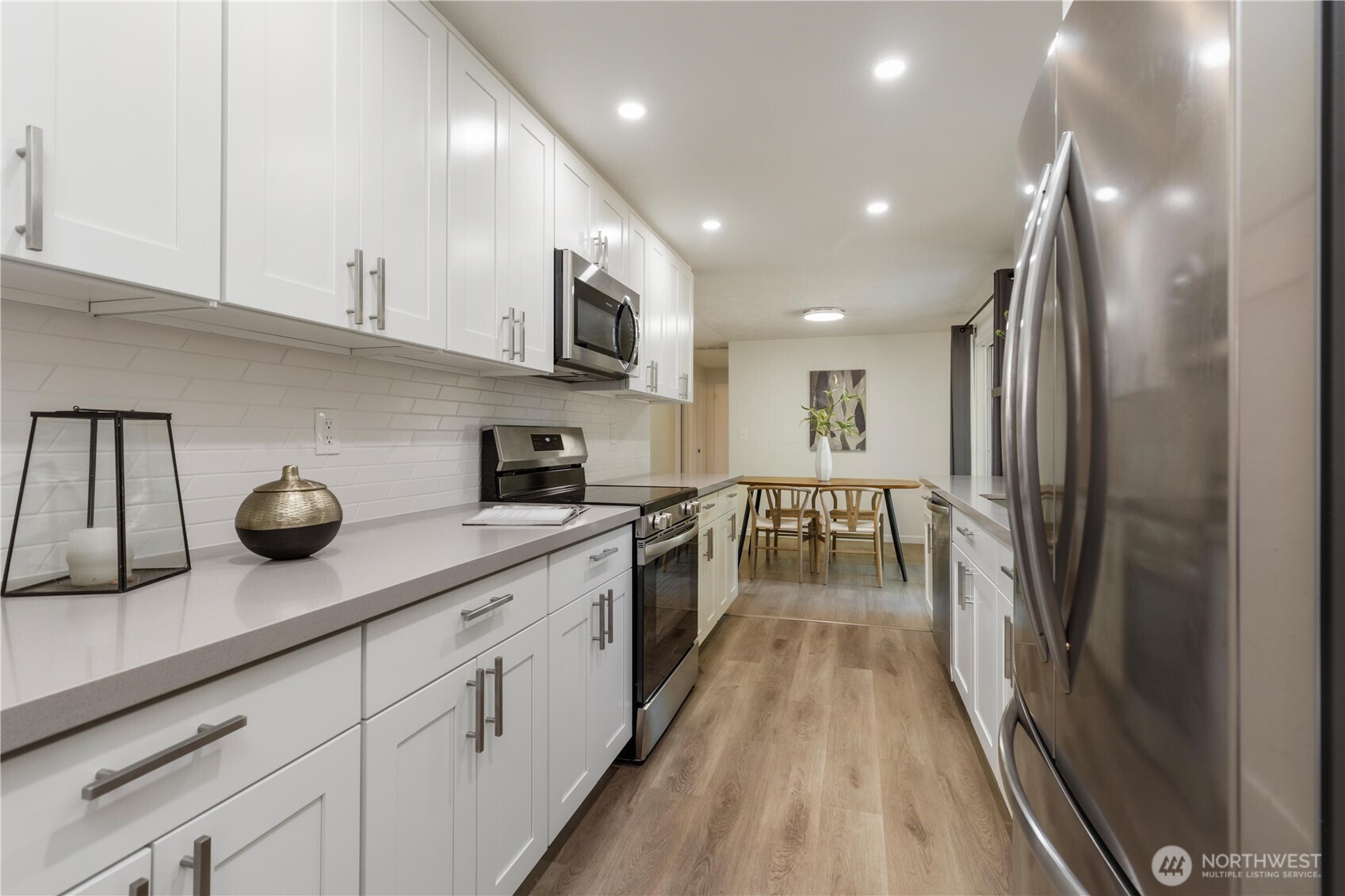 8423 198th Street Southwest Edmonds, WA 98026 - Photo 13 of 26 a kitchen with stainless steel appliances granite countertop lots of counter top space and cabinets