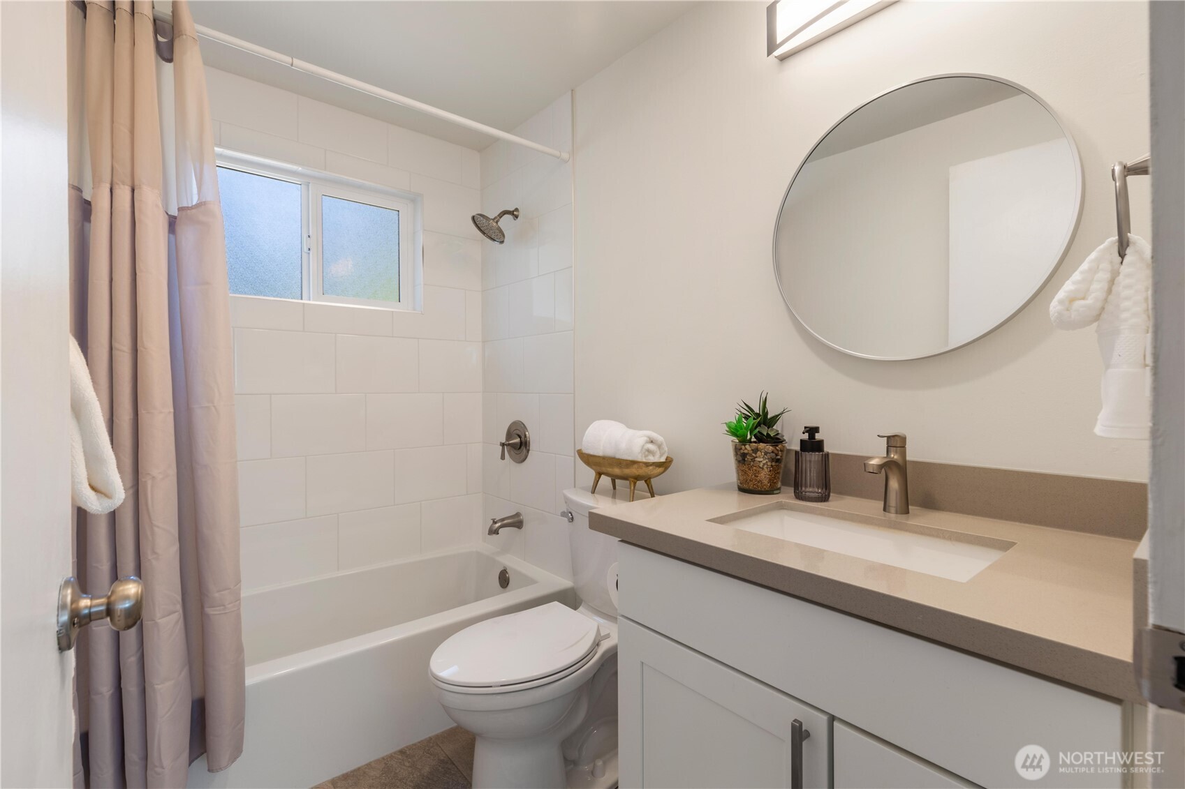 8423 198th Street Southwest Edmonds, WA 98026 - Photo 14 of 26 a bathroom with a sink a toilet and a mirror