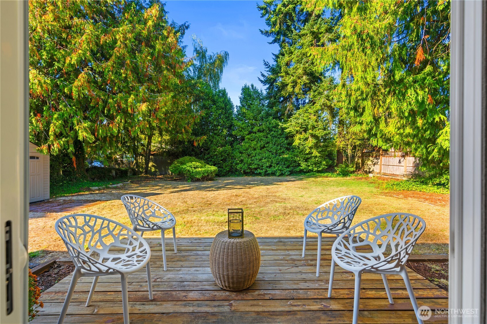 8423 198th Street Southwest Edmonds, WA 98026 - Photo 20 of 26 a view of a chairs and table in the patio with a yard
