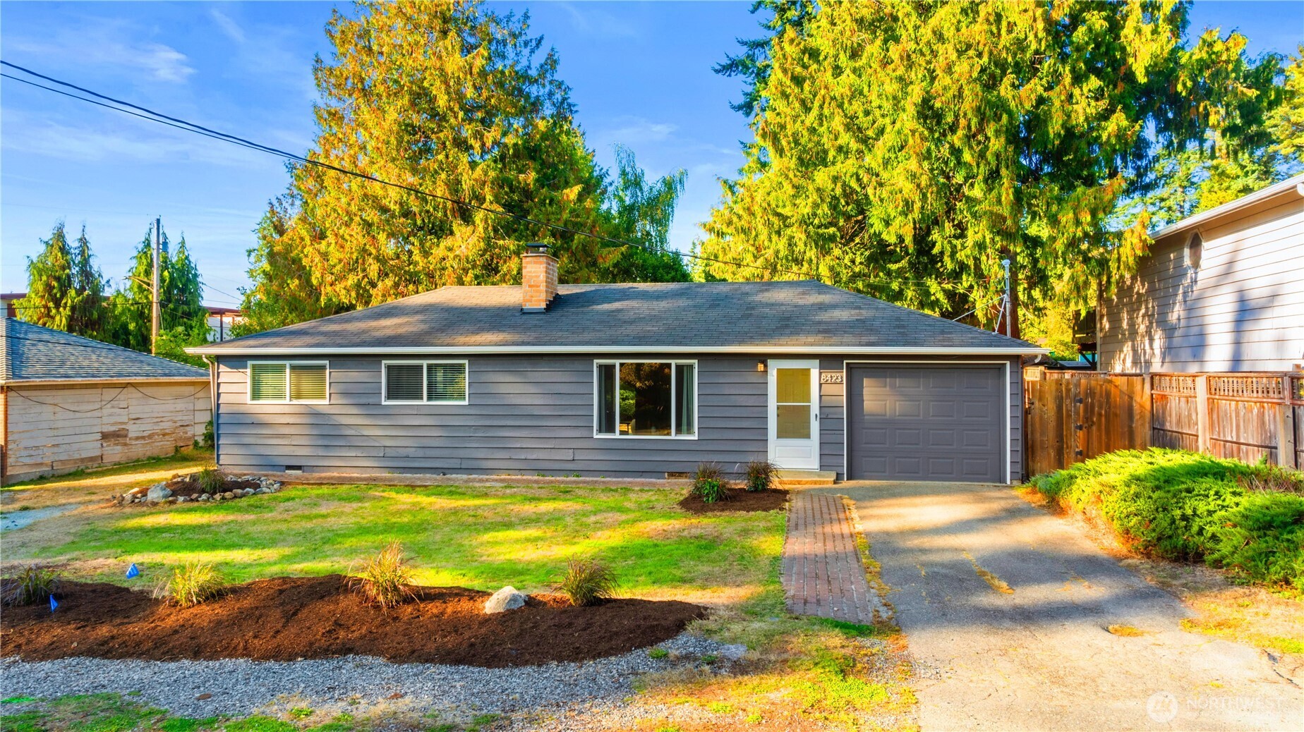 8423 198th Street Southwest Edmonds, WA 98026 - Photo 2 of 26 a view of a yard in front of a house with a large tree