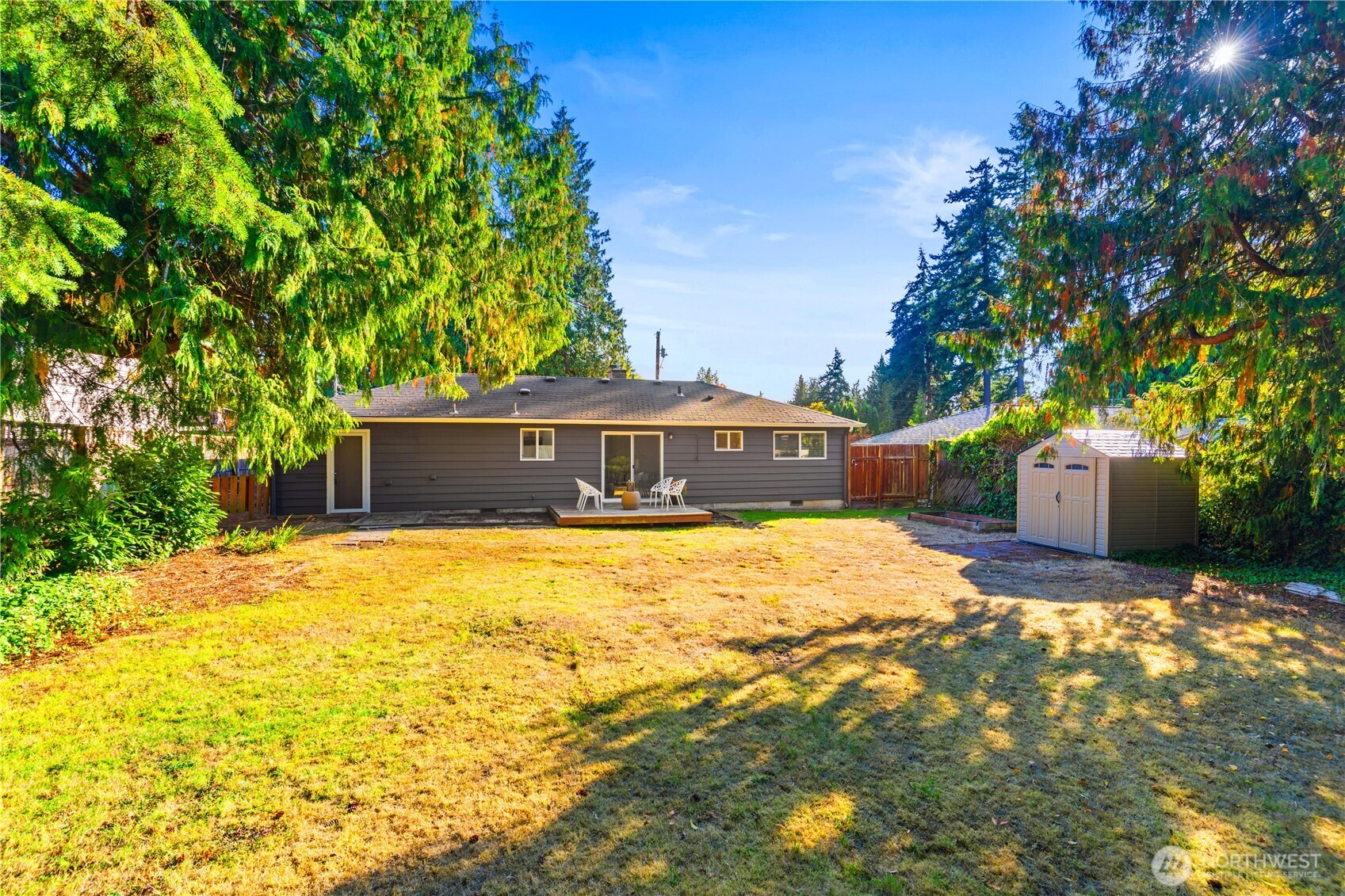 8423 198th Street Southwest Edmonds, WA 98026 - Photo 22 of 26 a swimming pool with trees in the background