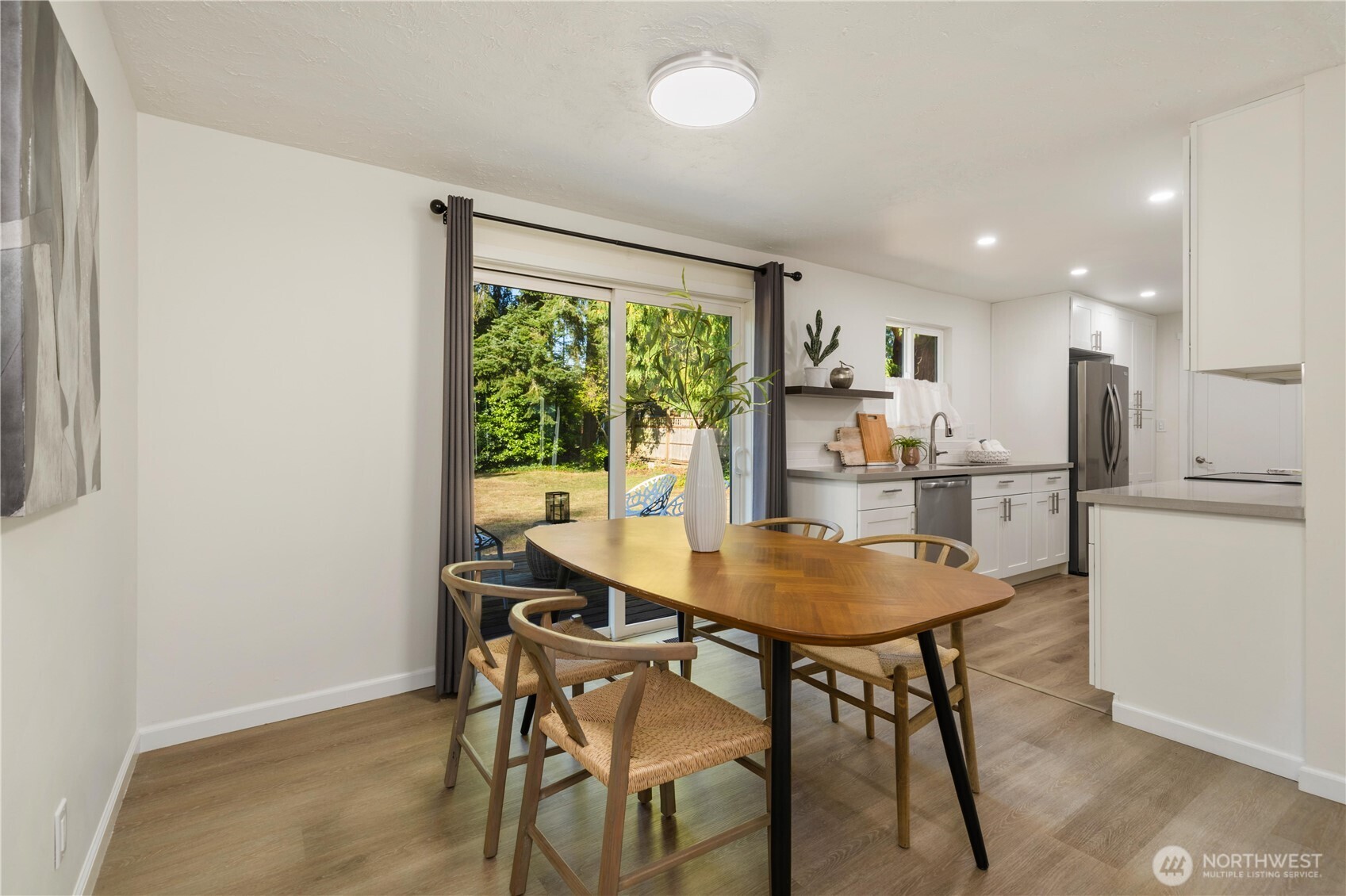 8423 198th Street Southwest Edmonds, WA 98026 - Photo 7 of 26 a view of a dining room with furniture window and outside view