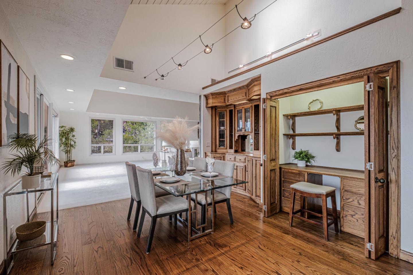 17070 Lon Road Los Gatos, CA 95033 - Photo 13 of 56 a dining room with furniture a chandelier and wooden floor