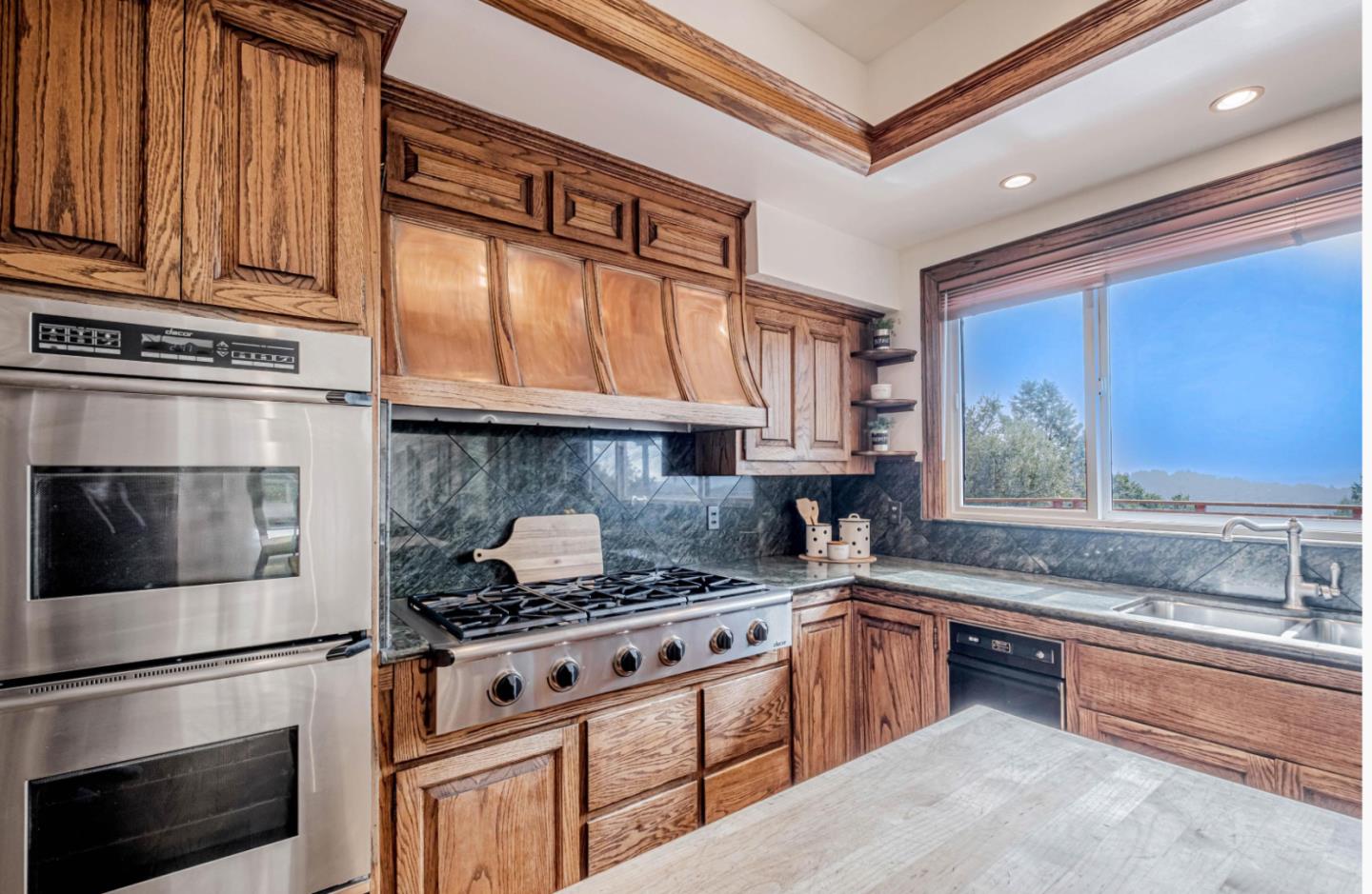 17070 Lon Road Los Gatos, CA 95033 - Photo 16 of 56 a kitchen with stainless steel appliances granite countertop a stove and a sink