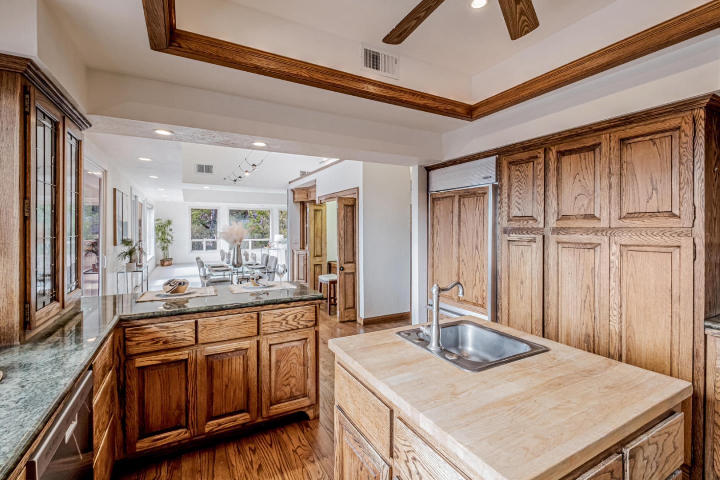 17070 Lon Road Los Gatos, CA 95033 - Photo 17 of 56 a kitchen with kitchen island a sink stove and view living room