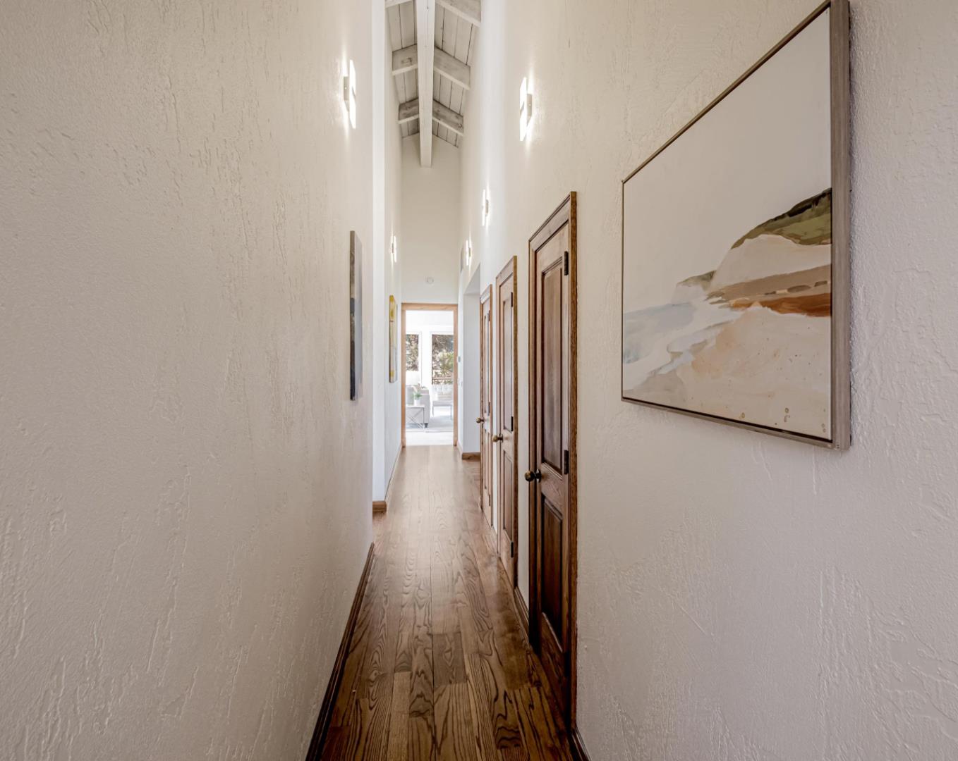 17070 Lon Road Los Gatos, CA 95033 - Photo 18 of 56 a view of a hallway with wooden floor and staircase