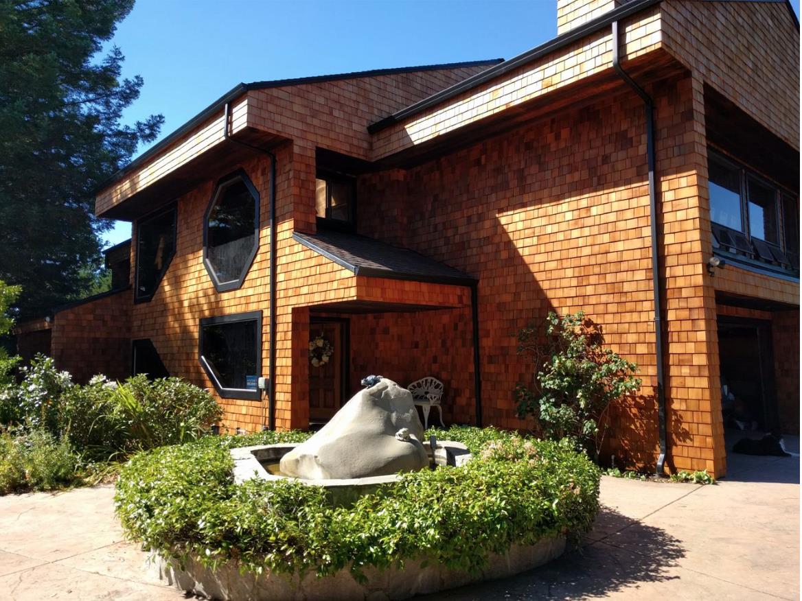17070 Lon Road Los Gatos, CA 95033 - Photo 2 of 56 a front view of a house with garden